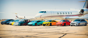 Exotic Lamborghinis, Porsches, Teslas, in front of private Jet